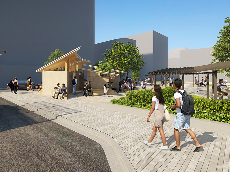 Public plaza with a wooden pavilion, people walking and sitting, trees, and modern buildings under a clear blue sky.